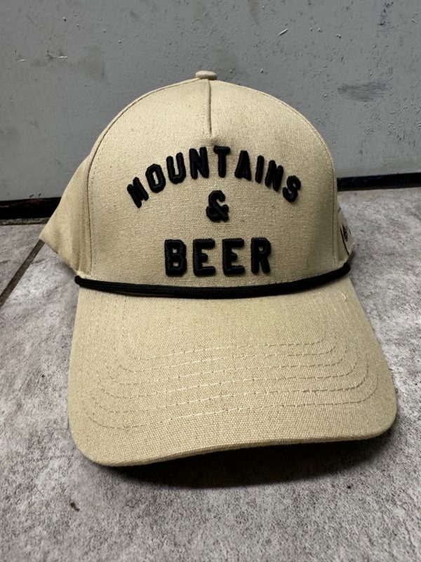 distant brewing mountains and beer hat tan and black front